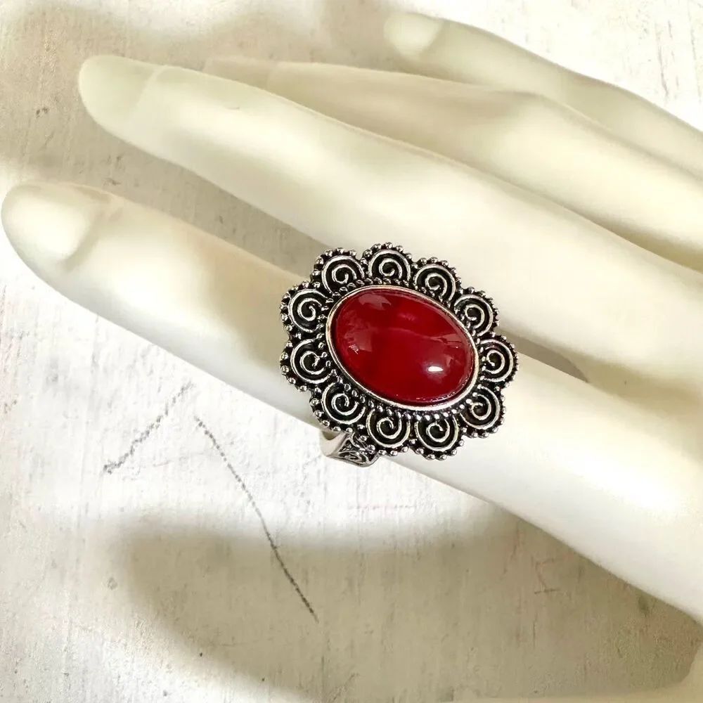 Silver tone and red ring
